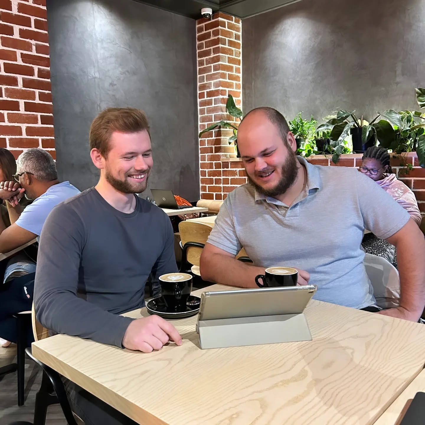 People reviewing campaign work together in a Jet Fuel Digital social post